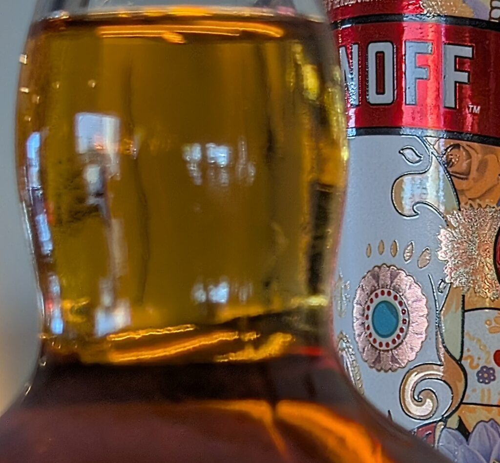 Image of backlit bottle of alcoholic beverages at the bar in Fish Hawk's of Dewey Beach